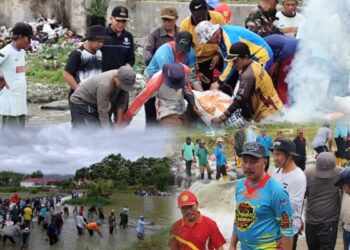 Warga bahu-membahu melakukan gotong royong membendung aliran Sungai Batang Merao, Minggu (13/7/2025).