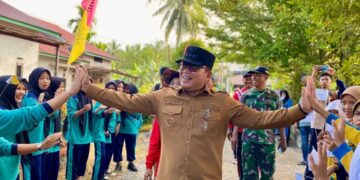 Sujiwo saat menghadiri peringatan Hari Ulang Tahun (HUT) ke-20 SMK Negeri 1 Kecamatan Sungai Kakap, Senin (15/12/2025).