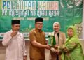 Sujiwo saat membuka Pelatihan Kader Pimpinan Cabang Muslimat Nahdlatul Ulama Kabupaten Kubu Raya yang digelar di Hotel Four Point, Sungai Raya, Selasa (23/12/2025).