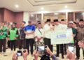 Peringatan Nuzulul Qur'an diisi juga dengan penyerahan kepesertaan BPJS ketenagakerjaan bagi ojol di Jember (foto: istimewa)